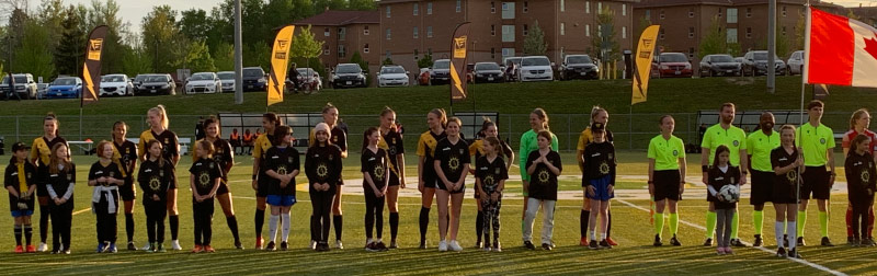 PCSA players taking part in the opening ceremonies at ECFC Women’s home game at Fleming Knight’s field.