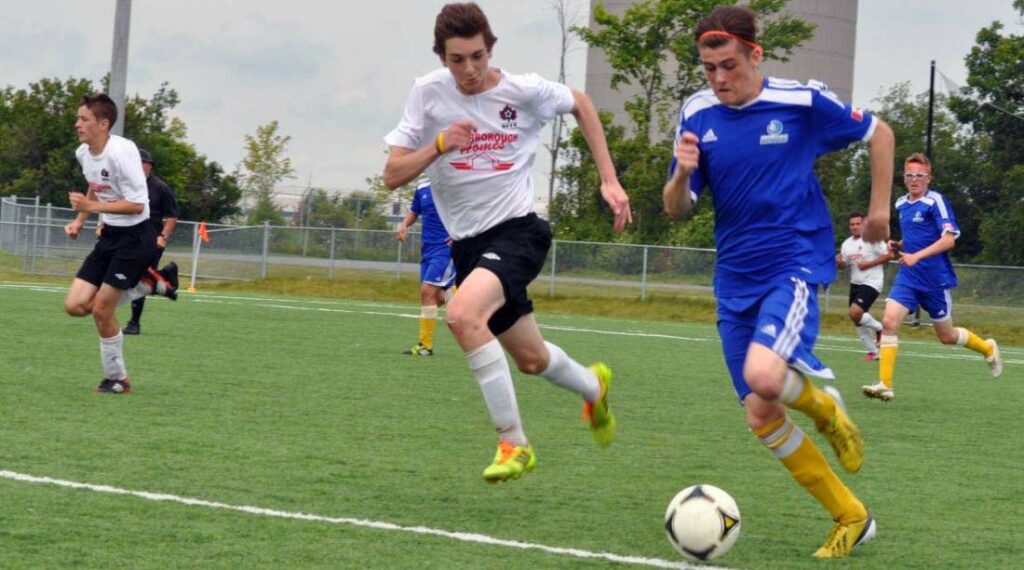 U17 Boys (white shirts) in action at the Kingston Ambassador Cup