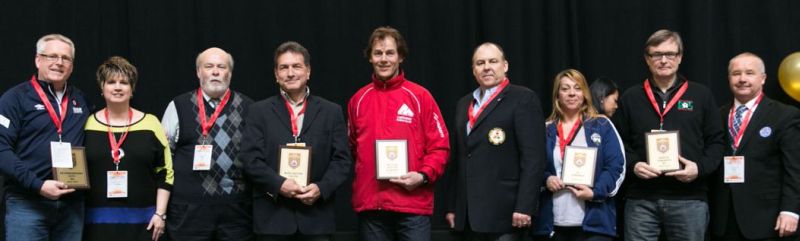 Mike Everson (left), with Leslee Bax (ECOSA), accepts the Gold Club Excellence award from OSA President Ron Smale (right) during the OSA Soccer Summit in Guelph on March 5, 2016