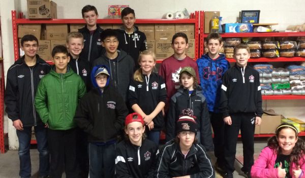 U14 Boys and siblings help sort food at Kawartha Food Share in December 2015